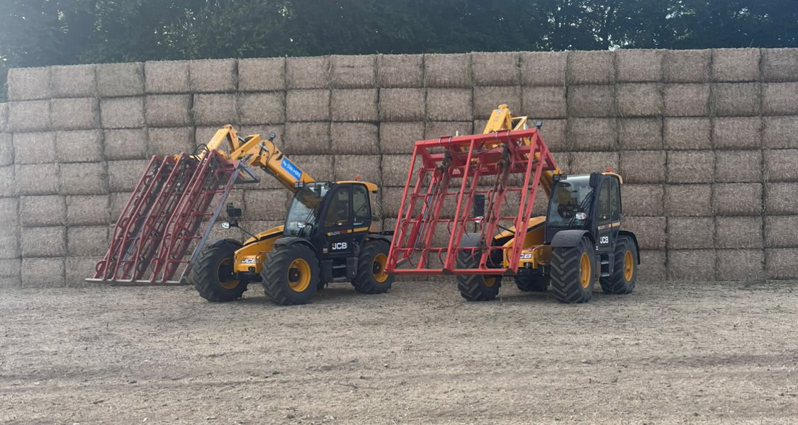 SW Hire JCB agri telehandlers with flat eight grab in front of straw stack